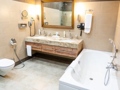Luxury bathroom with brown tiles